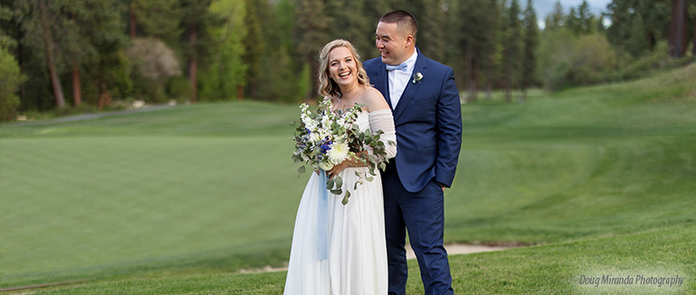 bride and groom outside the chateau at incline village with golf course 