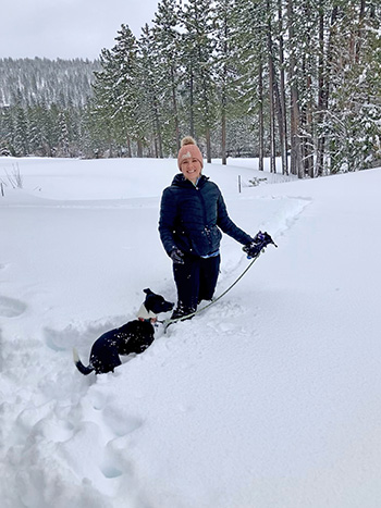 ashley and dog on the incline village golf course covered in snow