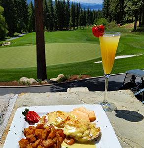 eggs benedict and mimosa overlooking lake tahoe and the championship golf course in incline village