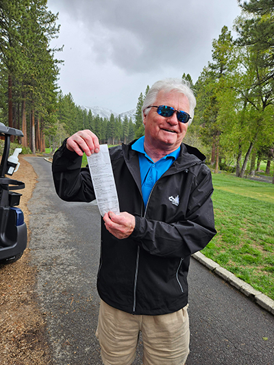 ranger with receipt at golf course
