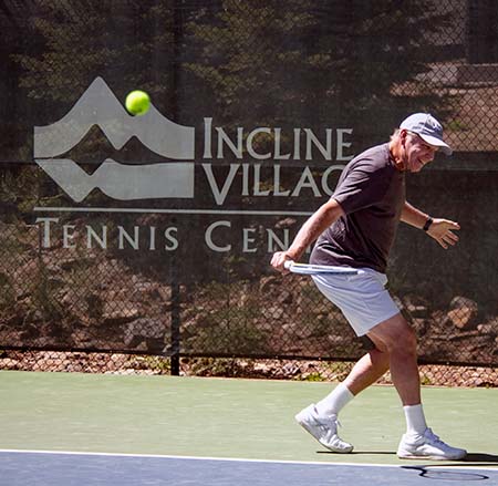 Randy Berg demonstrates a slice backhand stroke on the Incline Village Tennis courts