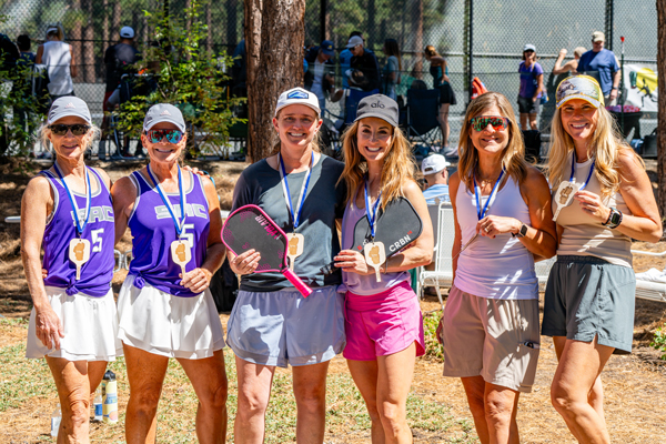 group of women with pickleball medals