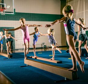 gymnasts on beam