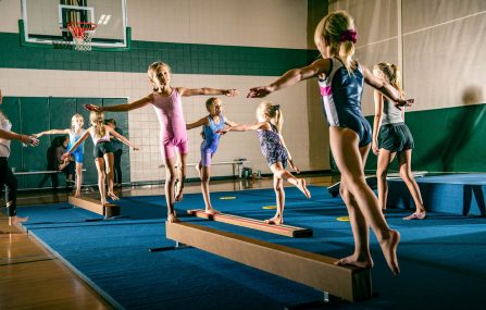 gymnasts on beam