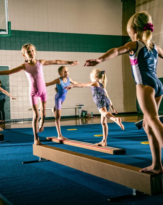 gymnasts on beam