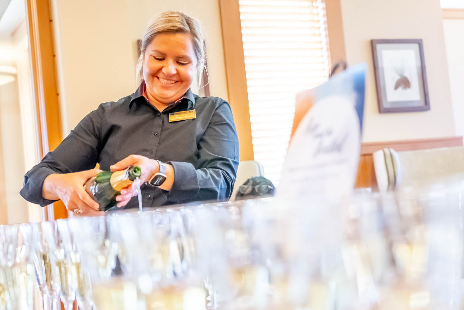 woman pouring champagne