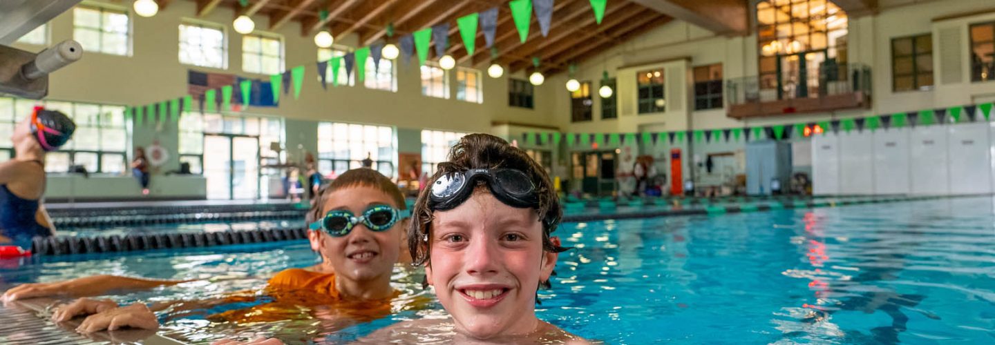 kids at edge of indoor pool