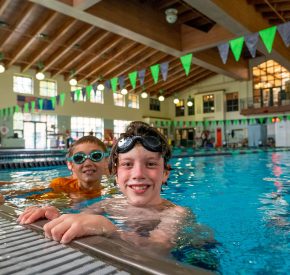 kids at edge of indoor pool