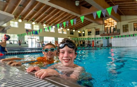 kids at edge of indoor pool