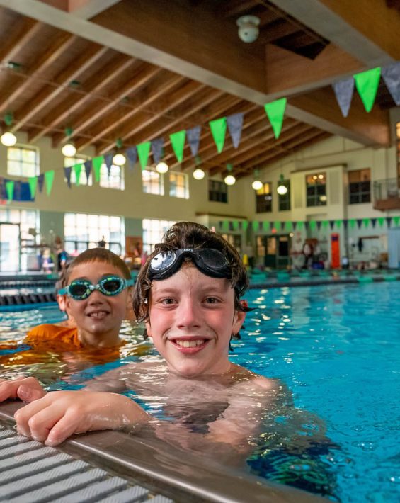 kids at edge of indoor pool