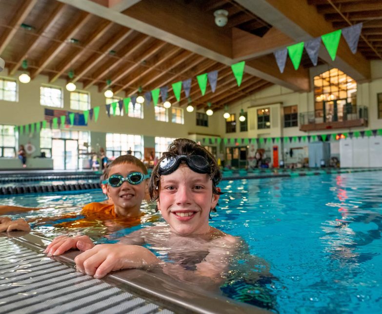 kids at edge of indoor pool