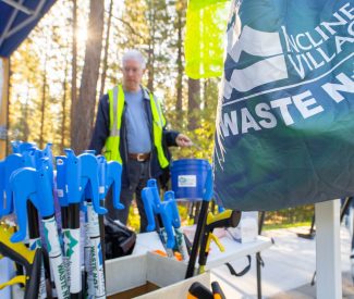 man with trash pick up tools