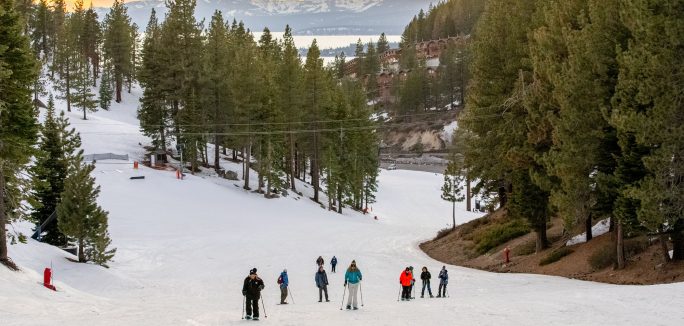 group snowshoe hikes during sunset at diamond peak