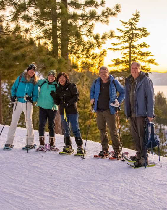 group snowshoe hikes during sunset at diamond peak
