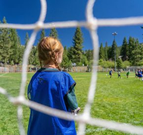 girl in soccer goal