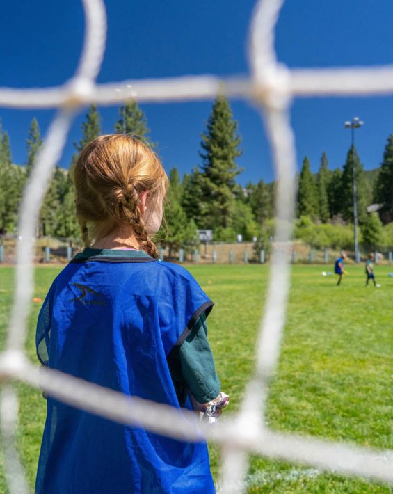 girl in soccer goal
