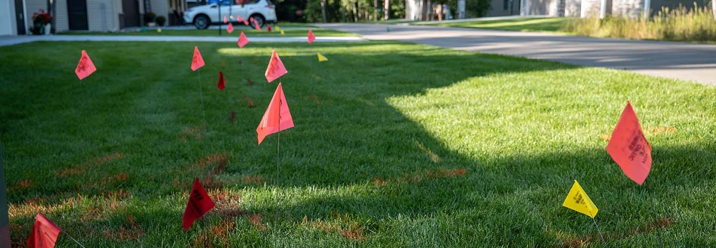 Buried utility lines marked with flags