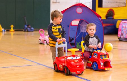 boys push cars