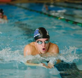 boy swimming in meet