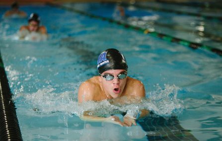 boy swimming in meet