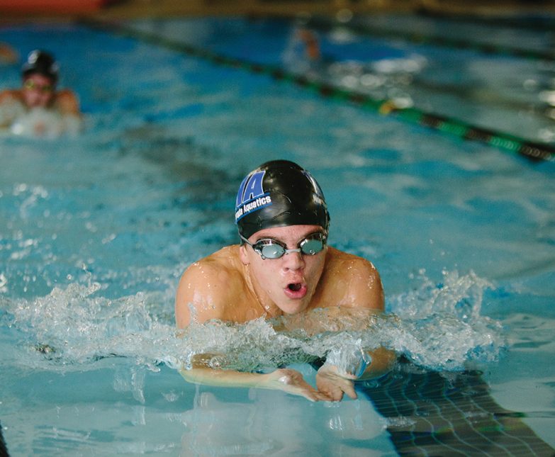 boy swimming in meet