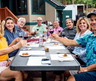 group cheersing at Mountain Golf Course Nine & Wine event