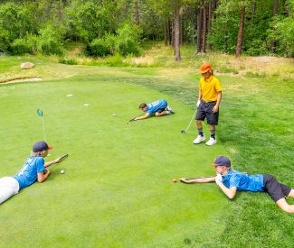 junior golf league players practice