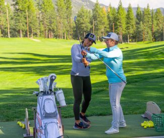 driving range lesson with ashley and woman
