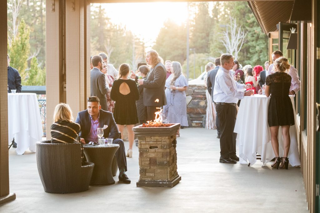 wedding guests at Chateau on patio