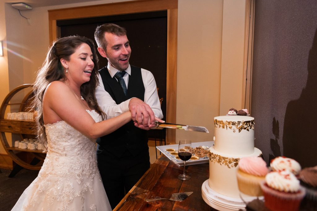 bride and groom cut cake at The Chateau 