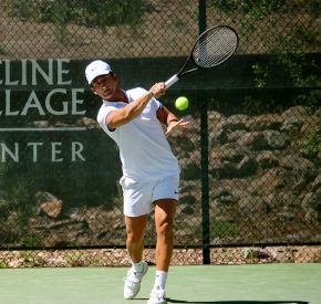 male tennis player in whites