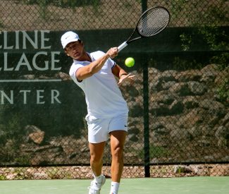 male tennis player in whites