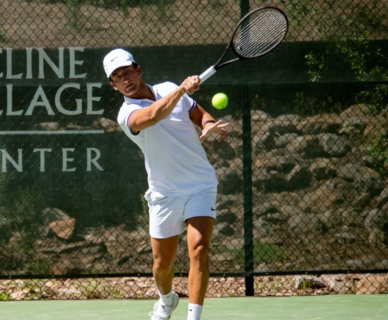 male tennis player in whites