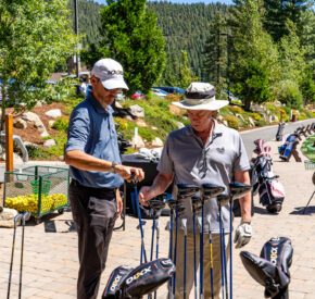 man with club fitter at the range