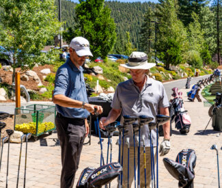 man with club fitter at the range
