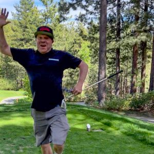 Al Bucknew hitting a hole-in-one