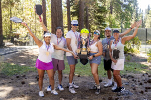 pickleball winners group with trophy