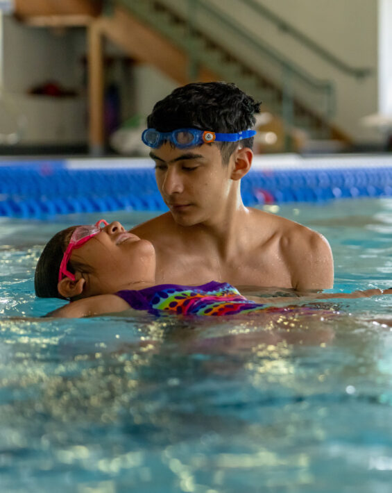 hispanic boy in swim lessons