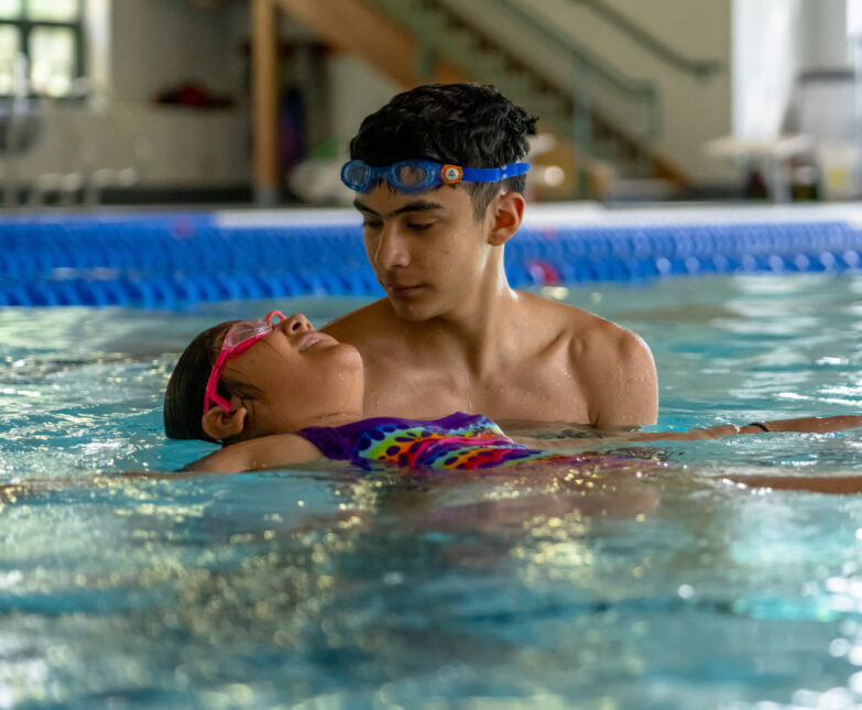 hispanic boy in swim lessons