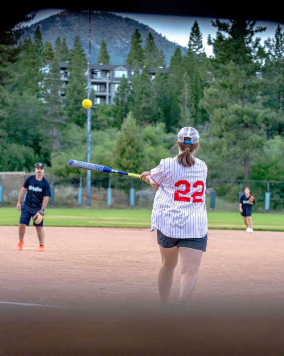 woman softball hitting