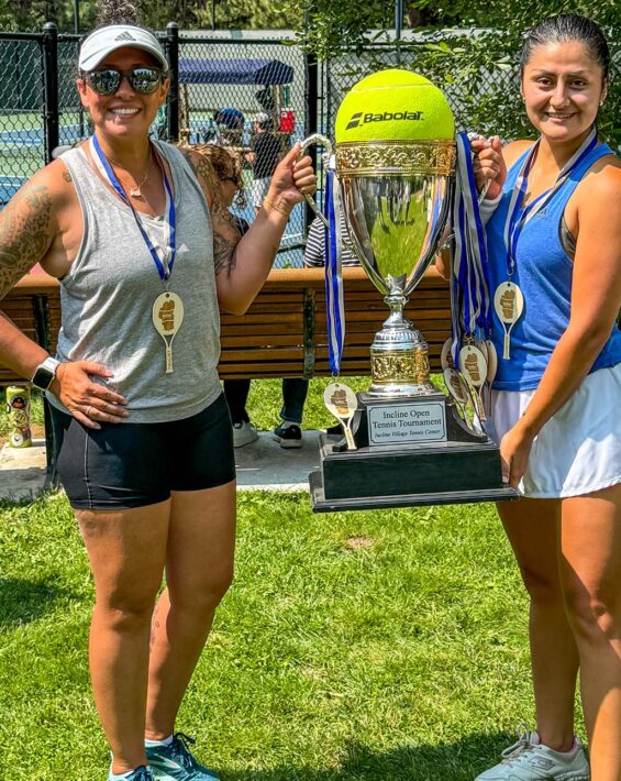 Incline Open Tennis Tournament finalists with trophy
