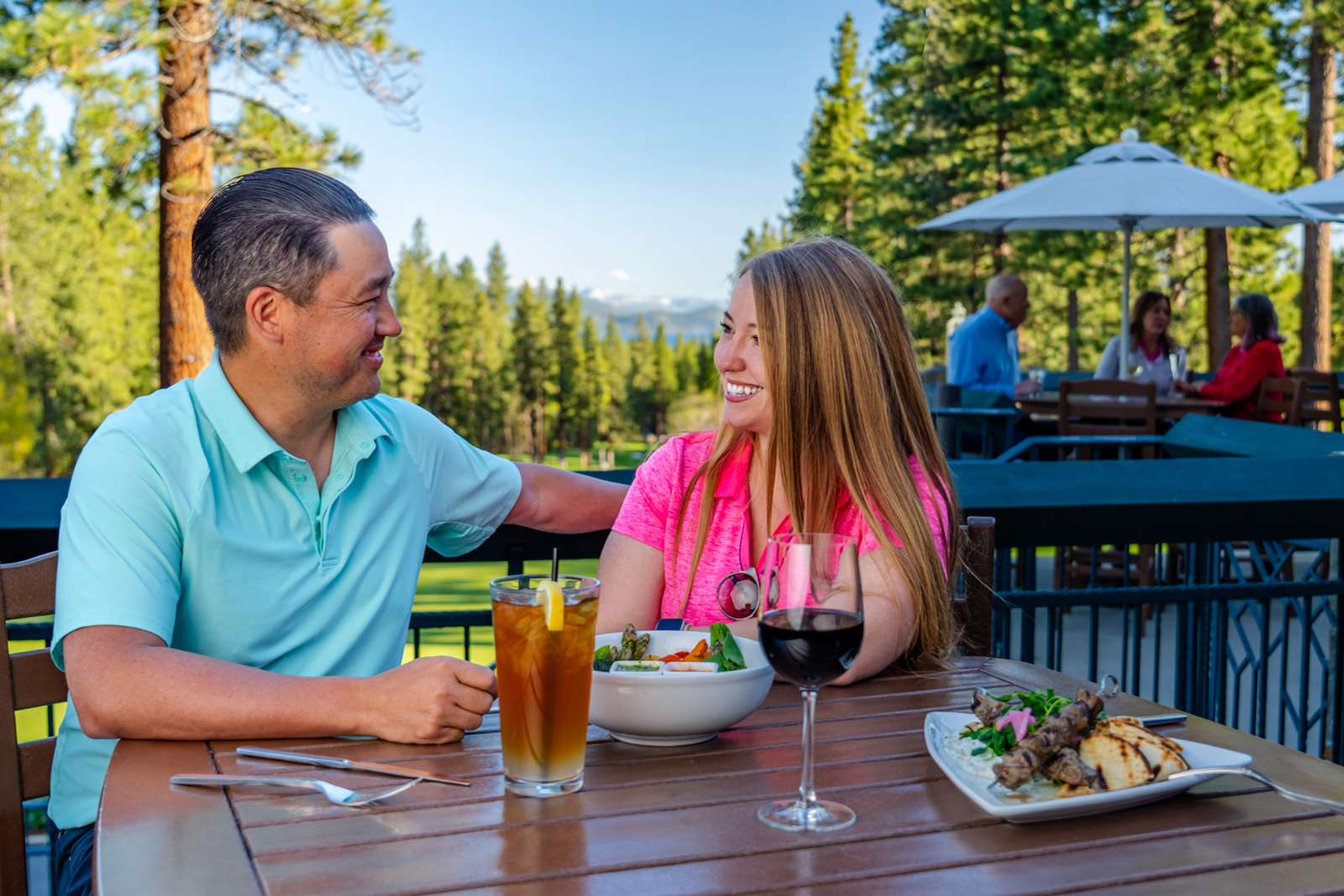 couple dining at The Grille for dinner on the patio