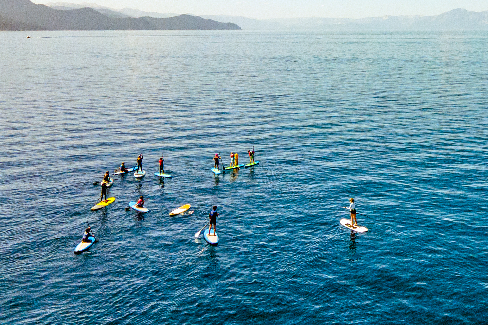 paddleboarders drone shot
