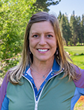 robyn bradford headshot at golf course<br />
