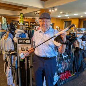 golf shop merchandise staff dads and grads pick ed with a putter