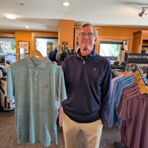 golf shop merchandise staff dads and grads pick rob holds up polo