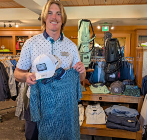 golf shop merchandise staff dads and grads pick dalton holds up hat and polo