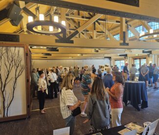 group at community open house at Chateau