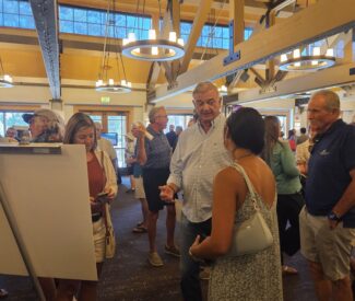 group at community open house at Chateau