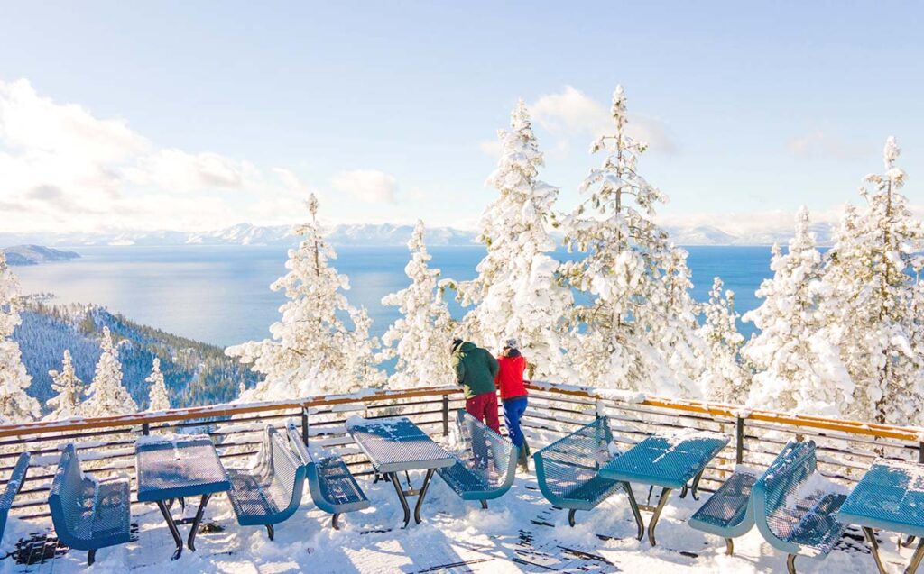 Couple on snowy Snowflake Lodge deck
